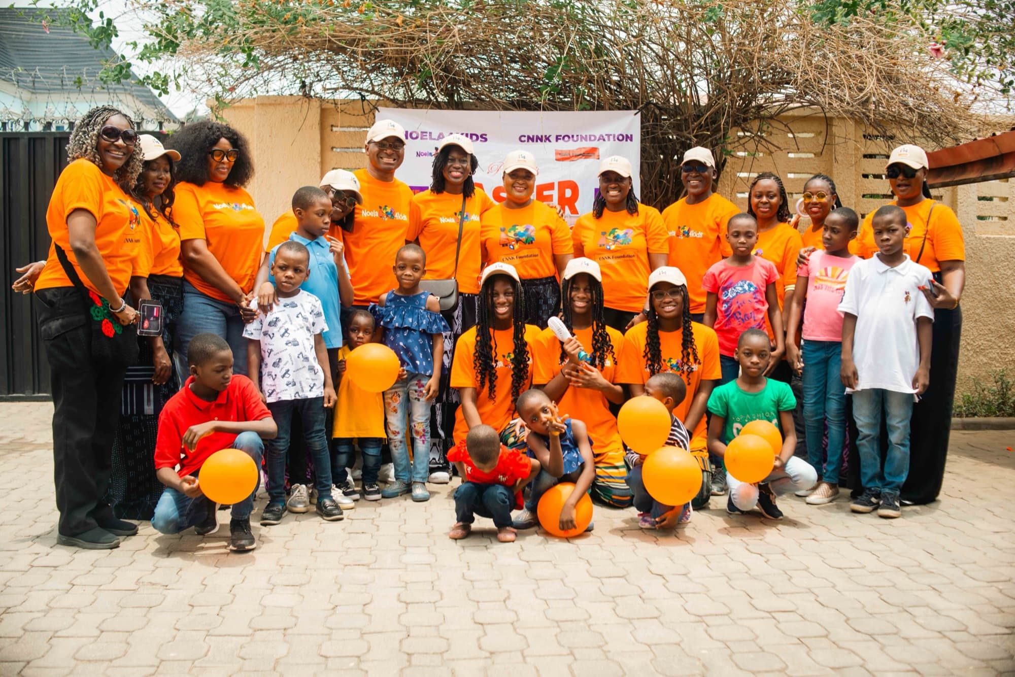 The Noela4kids and CNNK Foundation team with children at a community outreach event in Nigeria